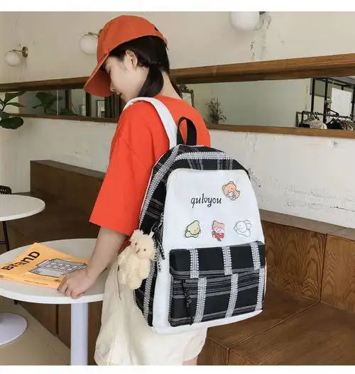 迪阿伦初中生书包女韩版高中学生可爱徽章原宿大学生ins风双肩包